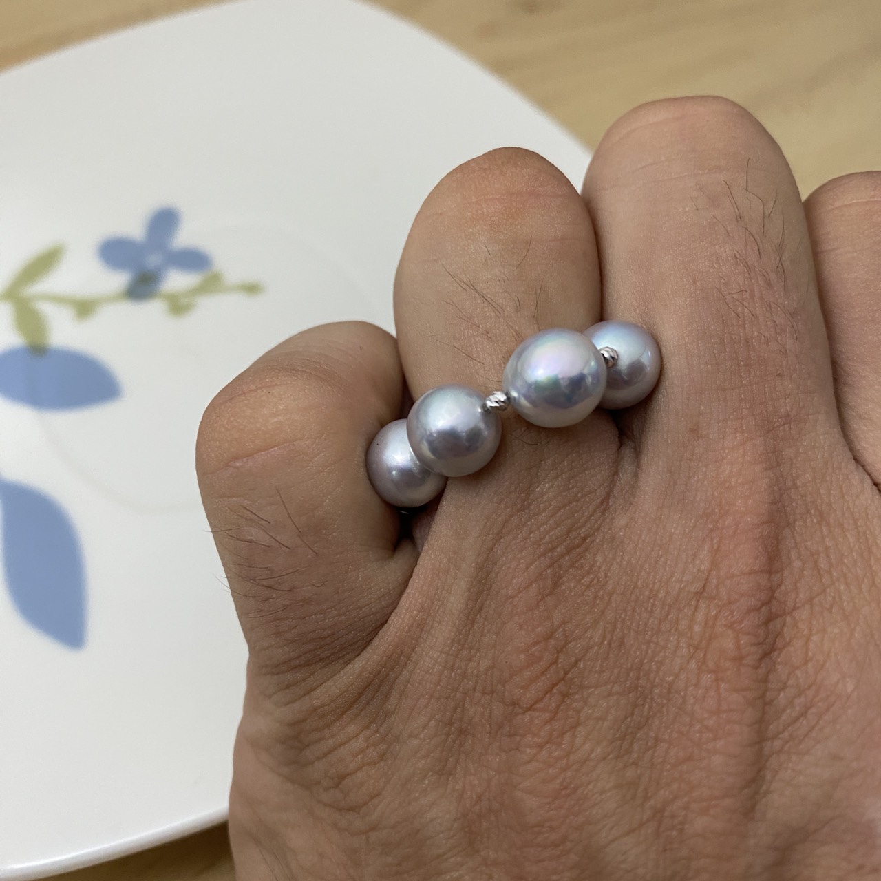 Natural blue Akoya pearl statement ring worn on a finger