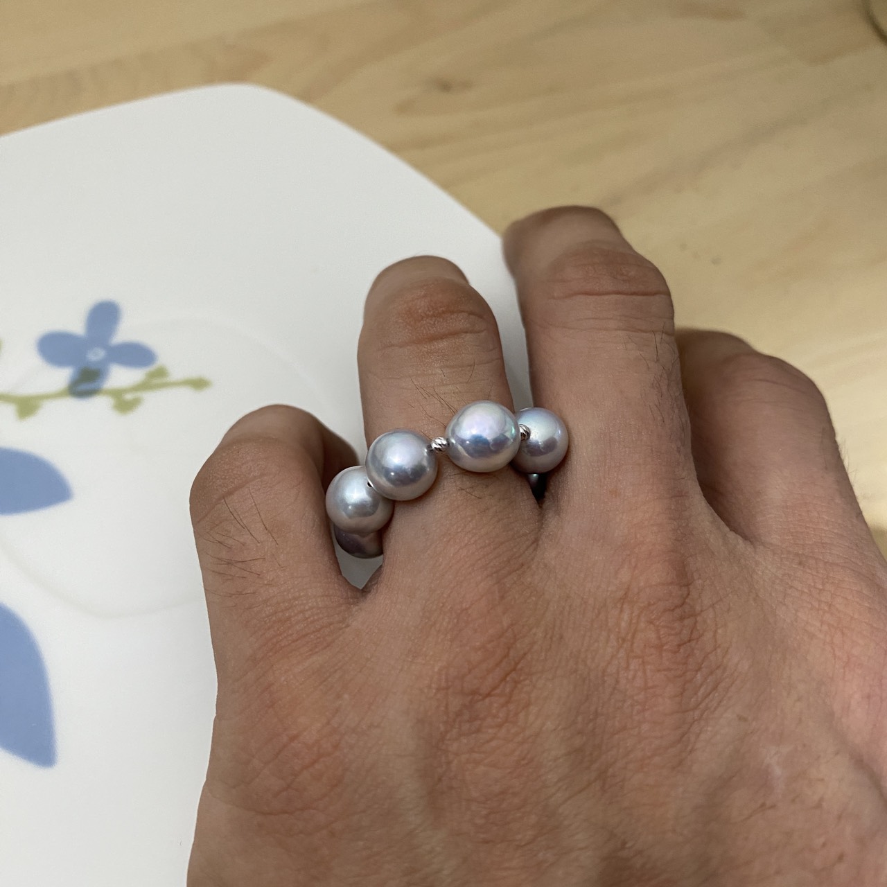 Japanese Akoya pearl ring worn on the hand for scale