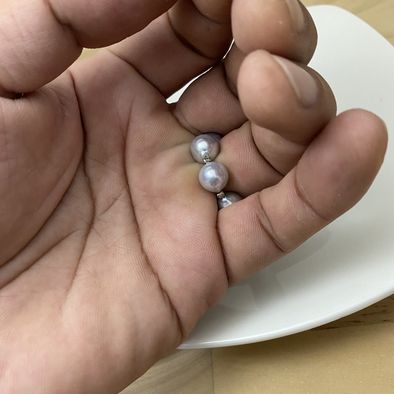 Inside view of the pearl ring showing wire connections between pearls