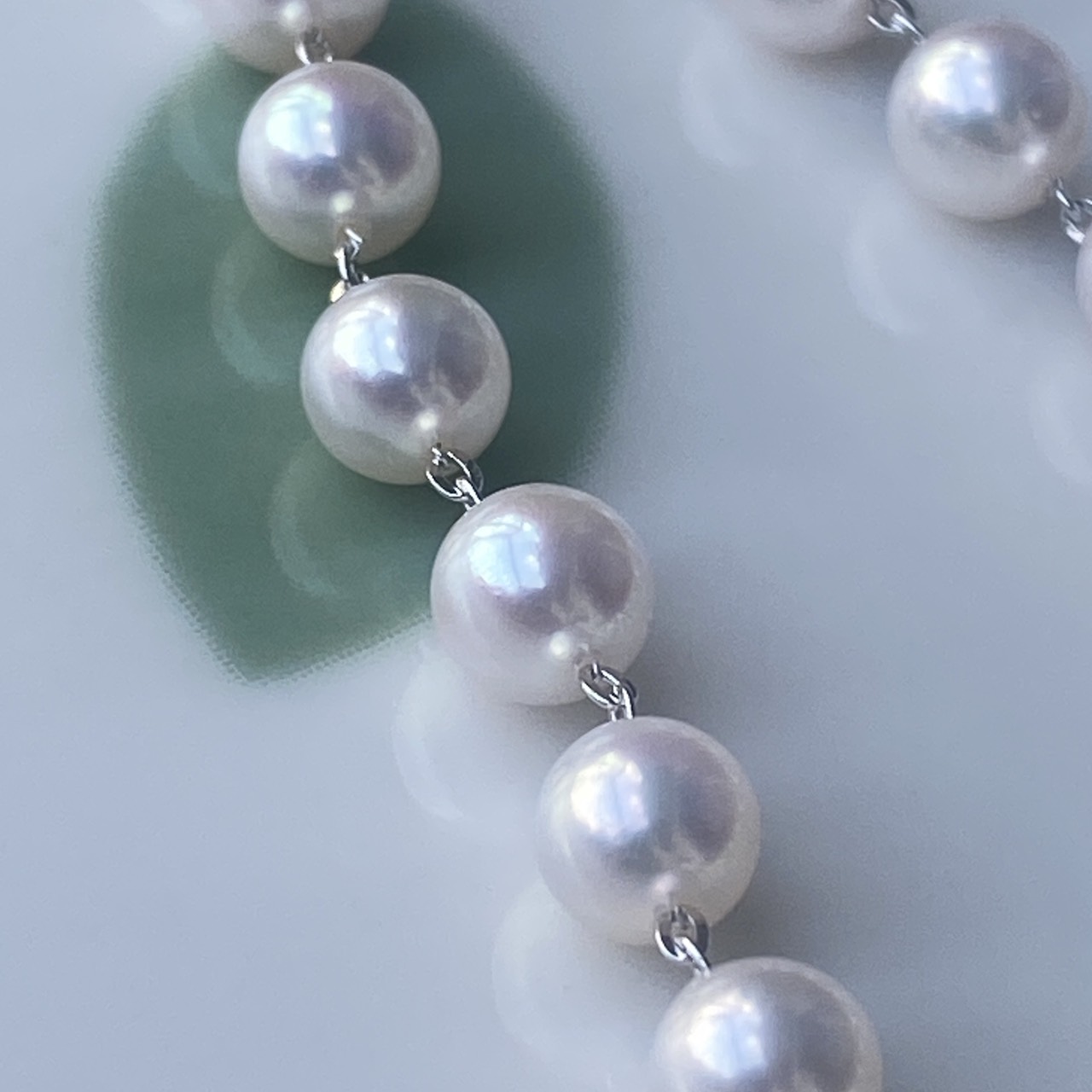 White-pink Akoya pearls joined by two-link Sterling Silver chain sections