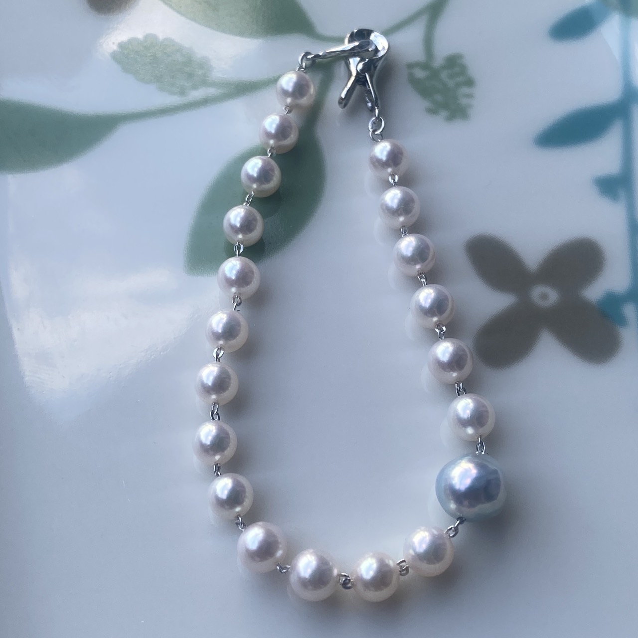 Full Morning Dream bracelet laid on a floral-patterned tray
