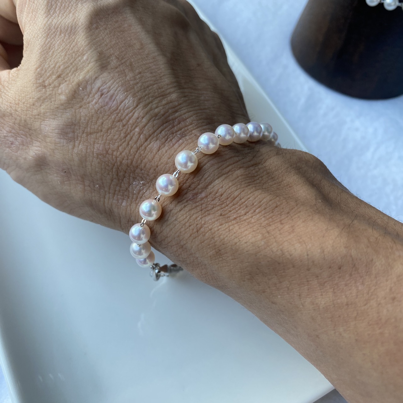 Akoya pearl bracelet worn on the wrist, showing its scale and fit.