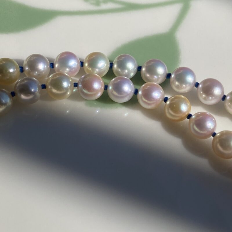 Blue thread hand-knotted between Japanese Akoya cultured pearls